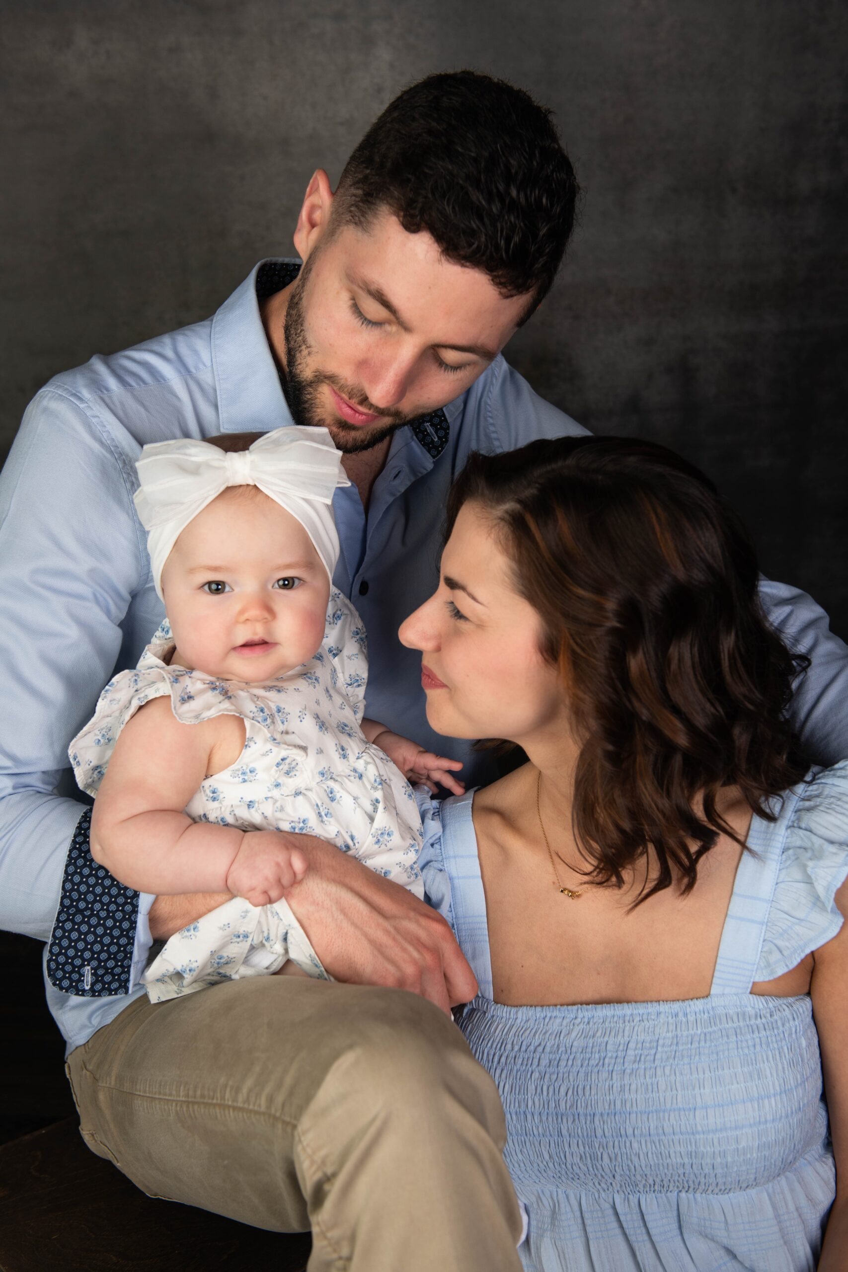 Couple holding their baby girl during a North Texas studio session