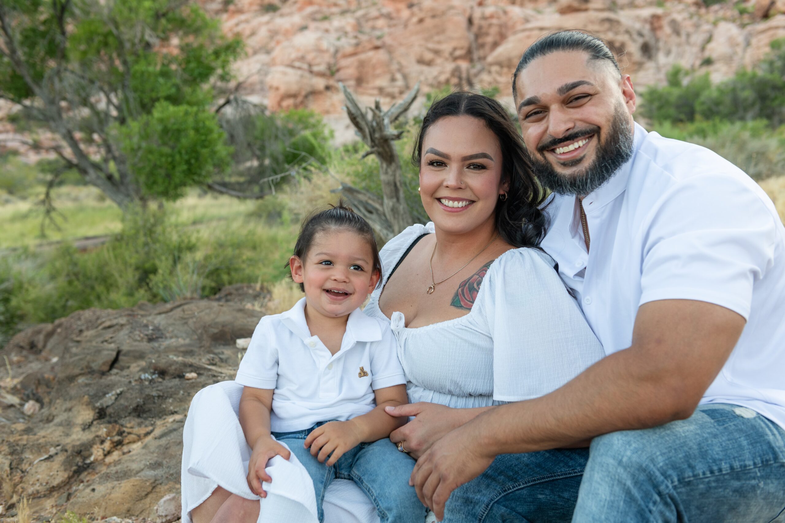 Parents with their toddler outdoors during a Prosper family session
